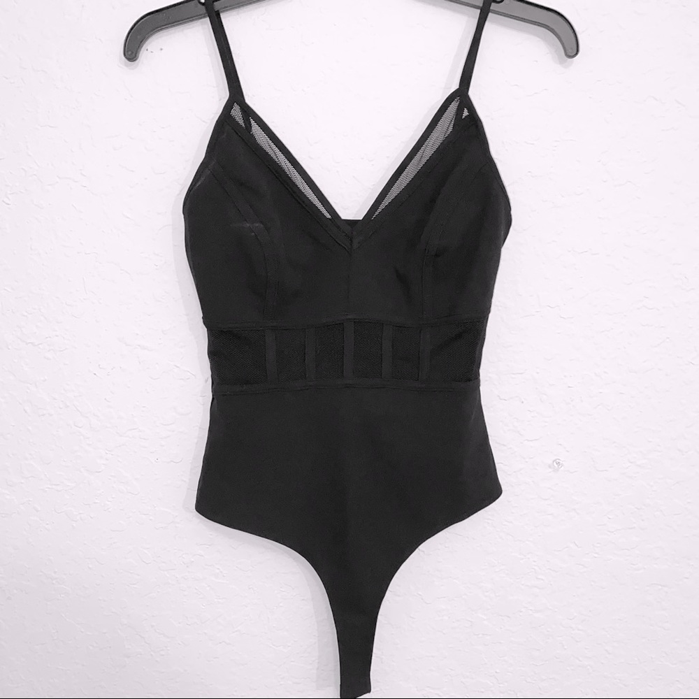 Black bodysuit with mesh inserts